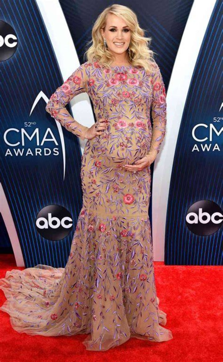 Pregnant CARRIE UNDERWOOD at American Country Countdown Awards 2014 in